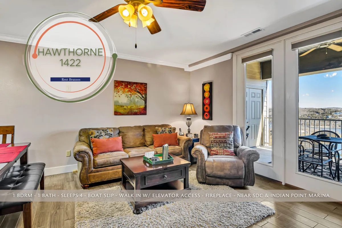 A cozy living area featuring a comfortable seating arrangement, large windows that frame scenic views outside, and decorative wall art. The room is bathed in natural light, creating a warm and inviting atmosphere ideal for relaxing with family or enjoying a cup of coffee by the fireplace.